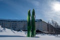 Umea, Sweden - March 2023: The illuminated scuplture green fire next to Umea Central Station.