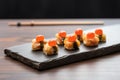 umeboshi lined up on a slate cheese board Royalty Free Stock Photo