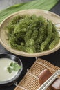 Umi-budou Seaweed or Green Caviar Healthy sea food or sea grapes seaweed on plate Royalty Free Stock Photo