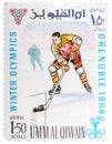 Stamp printed by Umm al-Quwain, shows hockey player bats the puck