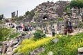UMM QAIS, JORDAN - MARCH 30, 2017: Tourists visit the ruins of Umm Qa