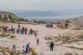 UMM QAIS, JORDAN - MARCH 30, 2017: Tourists visit the viewpoint of Sea of Galilee at the ruins of Umm Qa