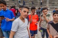 UMM QAIS, JORDAN - MARCH 30, 2017: Young boy tourists visit the West Theatre ruins in Umm Qa