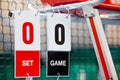 Umpire chair with scoreboard on a tennis court before the game. Royalty Free Stock Photo