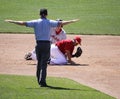 The umpire signals safe Royalty Free Stock Photo