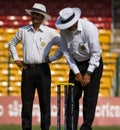 Umpires inspect Royalty Free Stock Photo