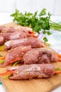 Un-cooked, pork meat rolls stuffed with vegetables pepper, carrots Royalty Free Stock Photo