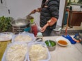 Unacquainted Chinese Chef Cooking Chinese traditional noodle in the Breakfast restaurant at zhangjiajie Downtown alley Royalty Free Stock Photo