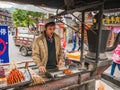 Unacquainted chinese people Grilling lamb in Fenghuang ancient town.