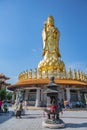 Unacquainted People with Guanyin goddress golden statue at foguangshan thaihua temple thailand