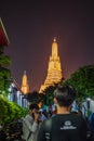 Unacquainted people walking in Wat arun in the night time. Royalty Free Stock Photo