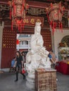 Unacquainted tourist with guanyin Goddess of Mercy statue in kaiyuan temple at chaozhou city Guangdong
