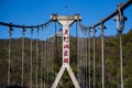 Unacquainted tourist walking on Suspension bridge cross the mountain at tianmen mountain Zhangjiajie china.Tianmen mountains