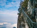 Unacquainted Tourists on Glass Cliff walk in tianmen mountain at Zhangjiajie city china. Royalty Free Stock Photo