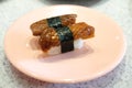 Unagi eel sushi on pink dish