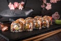 Unagi roll with smoked eel, avocado, cream with Philadelphia cheese, tobiko caviar. Sushi menu. Royalty Free Stock Photo