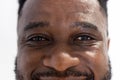 Unaltered portrait of eyes of african american male doctor smiling