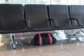 Unattended bag left under chair in the airport or bus or train station. Royalty Free Stock Photo