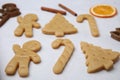 Unbaked biscuits and cookie cutters on light table, closeup Royalty Free Stock Photo