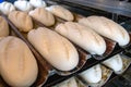 Unbaked bread dough on baking trays