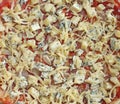 Unbaked pizza with cheese
