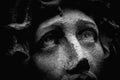 Unbearable pain in mind. Close up portrait of Jesus Christ crown of thorns. Fragment of very ancient stone statue