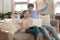 Happy yelling young spouses getting email of winning lottery jackpot Royalty Free Stock Photo