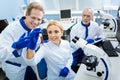 Happy scientists working with test tubes