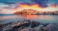 Unbelievable summer sunrise on Aegean Sea. Spectacular morning cityscape of Kavala city, the principal seaport of eastern Macedoni Royalty Free Stock Photo