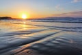 Unbelievable sunrise. Beautiful summertime view seascape. The wet sand on the sea coast. Morning landscape. Island Crete, Greece. Royalty Free Stock Photo