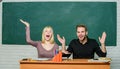 That is unbelievable. University students gesturing. High school education. Couple studying in classroom. Man and woman Royalty Free Stock Photo