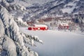 Unbelievable winter view of Vestvagoy island with typical norwegian red wooden houses, Norway, Europe.