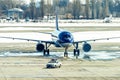 Unbranded blue plane taxiing after follow me car Royalty Free Stock Photo