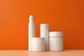 Unbranded Cosmetic Jars And Tubes Displayed Against An Orange Backdrop In An Elegant Mockup