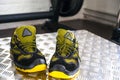 Unbranded modern sneaker in the gym. Black-Yellow. Comfortable shoes.