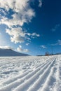 Unbroken ski slope, sun and blue sky Royalty Free Stock Photo