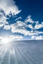 Unbroken ski slope, sun and blue sky Royalty Free Stock Photo