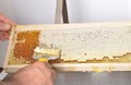 Uncapping of honeycomb at plastic tub Royalty Free Stock Photo