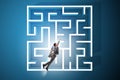 The uncertainty concept with businessman lost in maze labyrinth