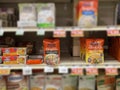 Uncle Bens rice packs in a grocery store with face removed
