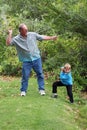 Uncle teaches boy to skip stones