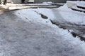 Uncleaned from snow, icy sidewalk