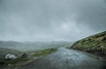 Unclear and blurred view Front window car in between raining. Winding country road or a little winding mountain stream. A path Royalty Free Stock Photo