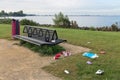 Uncollected rubbish at picnic place near lake