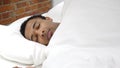 Uncomfortable African Man Sleeping in Bed at Night, Restlessness Royalty Free Stock Photo