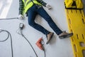 Unconscious electrician worker lying on the floor