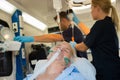 Unconscious patient with oxygen mask in ambulance