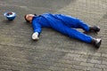 Unconscious Repairman In Uniform Lying On Street