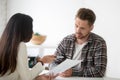 Unconvinced skeptical client looking doubtful about deal listeni