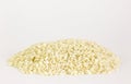 Uncooked arborio rice. Risotto rice on white background. Pile of Arborio short grain white rice isolated on white. Background of Royalty Free Stock Photo